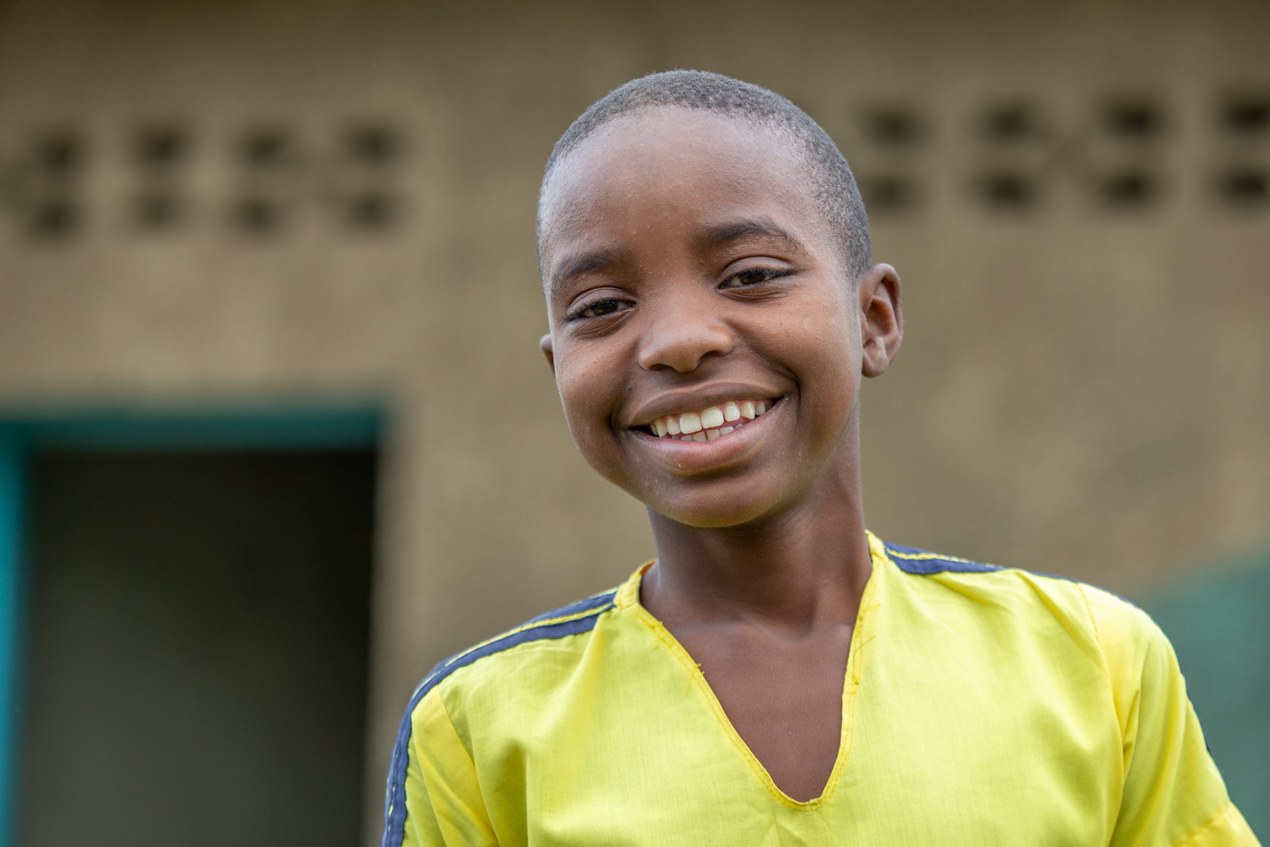 Young boy smiling at camera